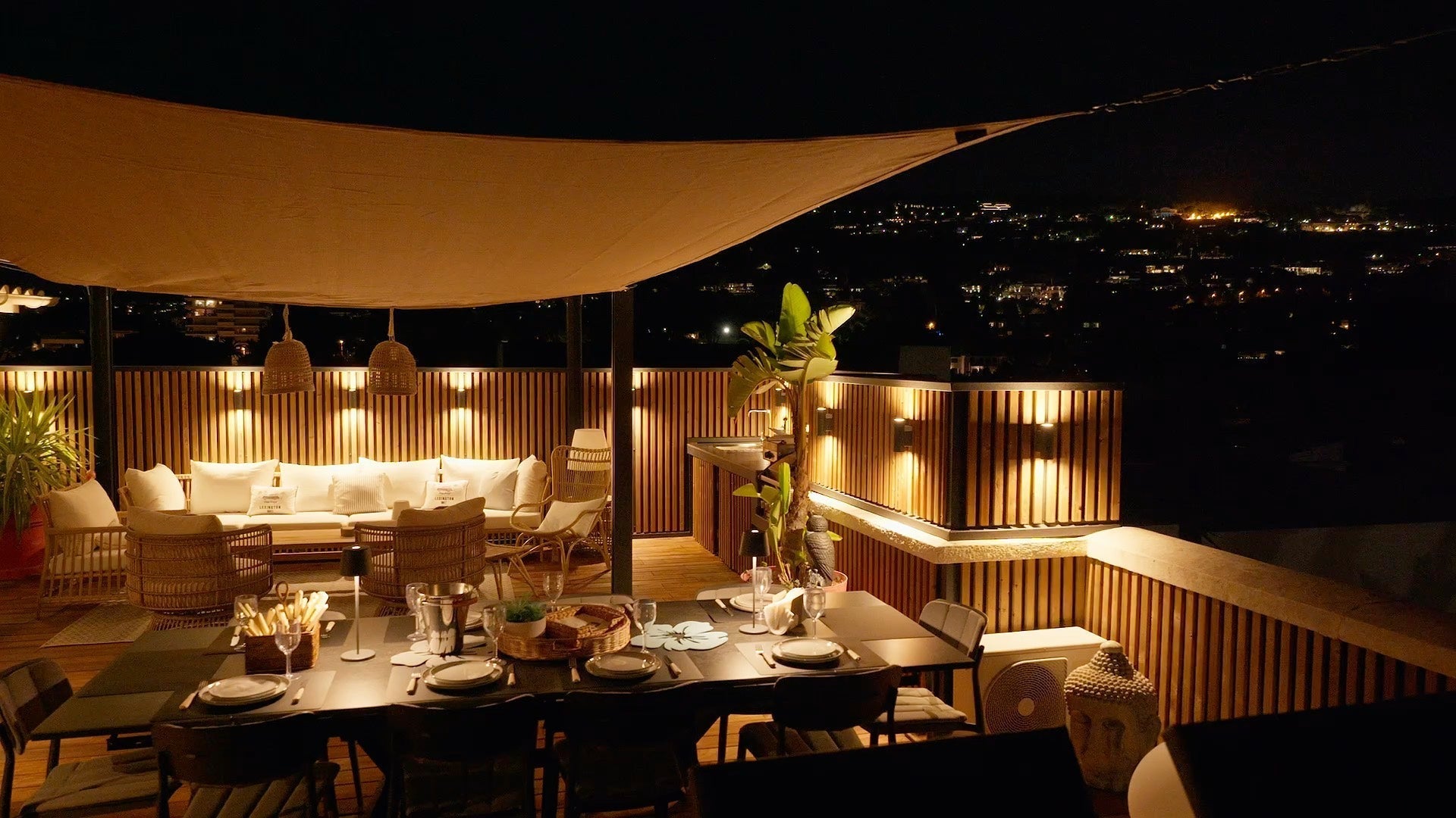 A Cannes rooftop terrace clad in Aluwood after dark, lit from the slats themselves.