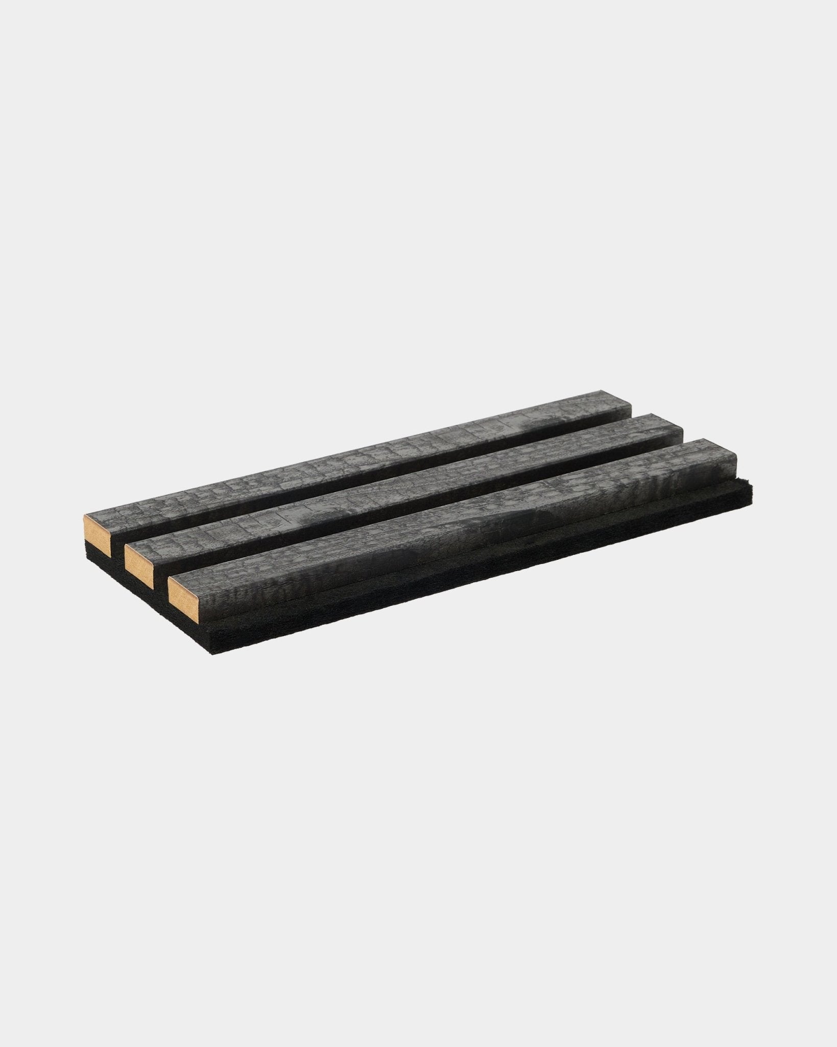 L’échantillon de dessous-de-plat Rebel charbon de WoodUpp, composé de quatre lattes en bois black, illustre la durabilité et le design nordique minimaliste des accessoires Panneau acoustique.